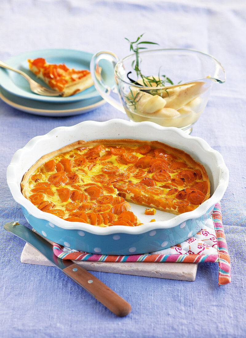 Carrots tart with spicy pear sauce in baking tray