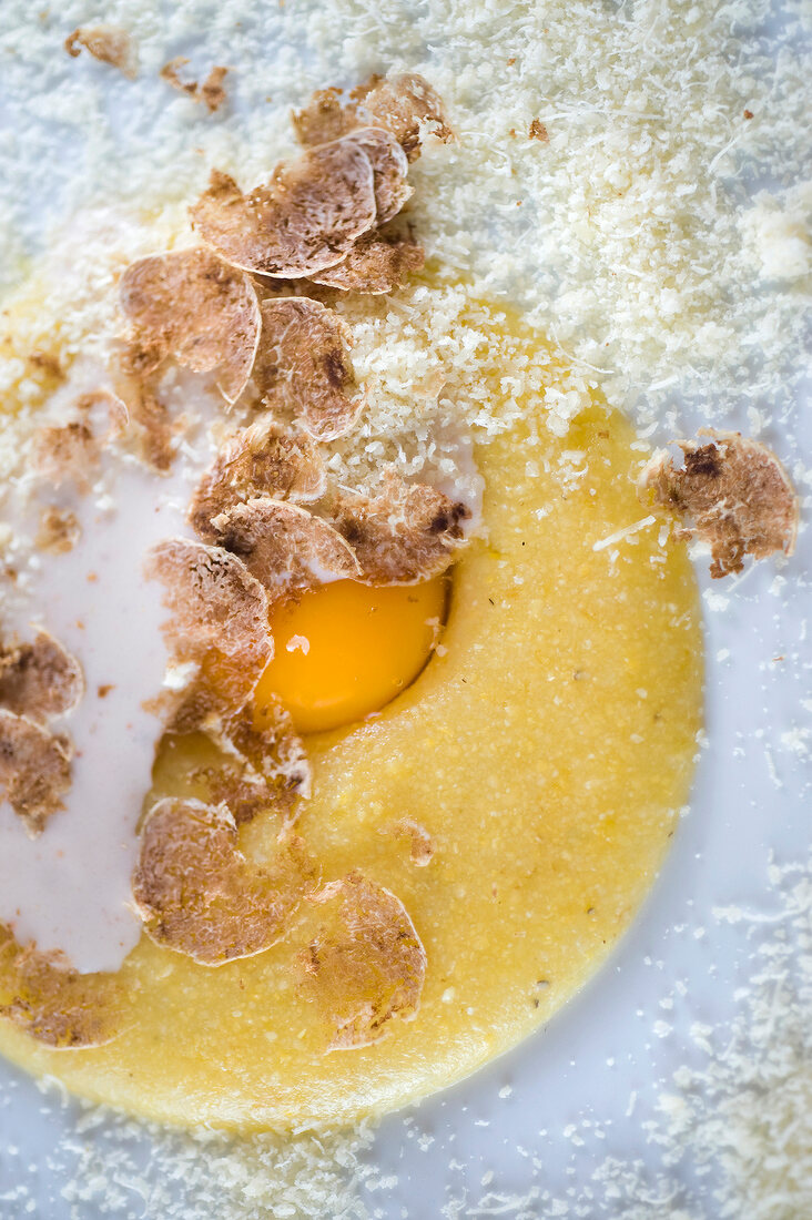 Close-up of polenta with egg and truffles