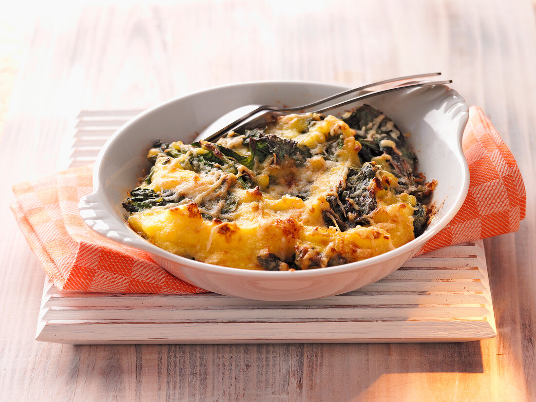 Spinach with mashed potatoes in serving bowl