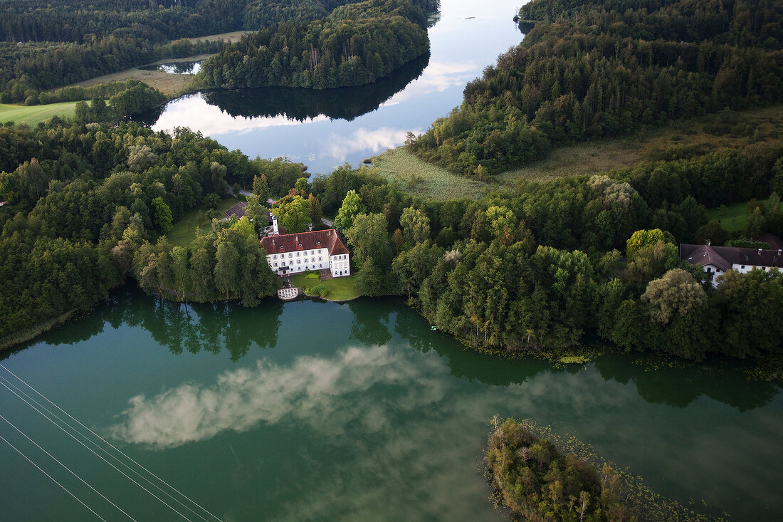 View of castle Hartmannsberg around Eggstatt Hemhofer Lake in Bavaria, Germany