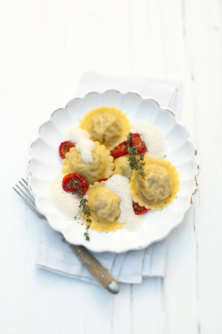 Lamb ravioli with sheep and goat cheese on plate