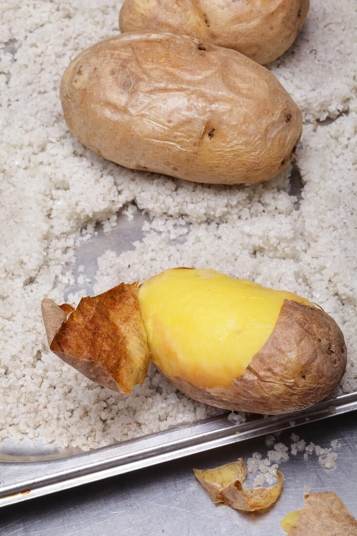 Peeled potatoes on ricotta cheese