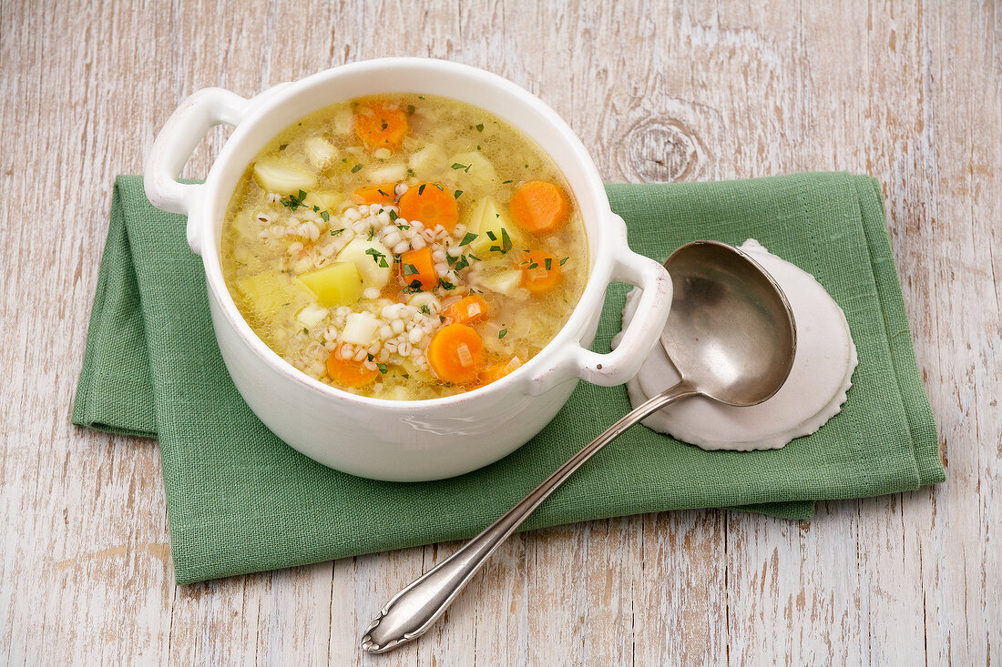 Grains and vegetable soup in wok