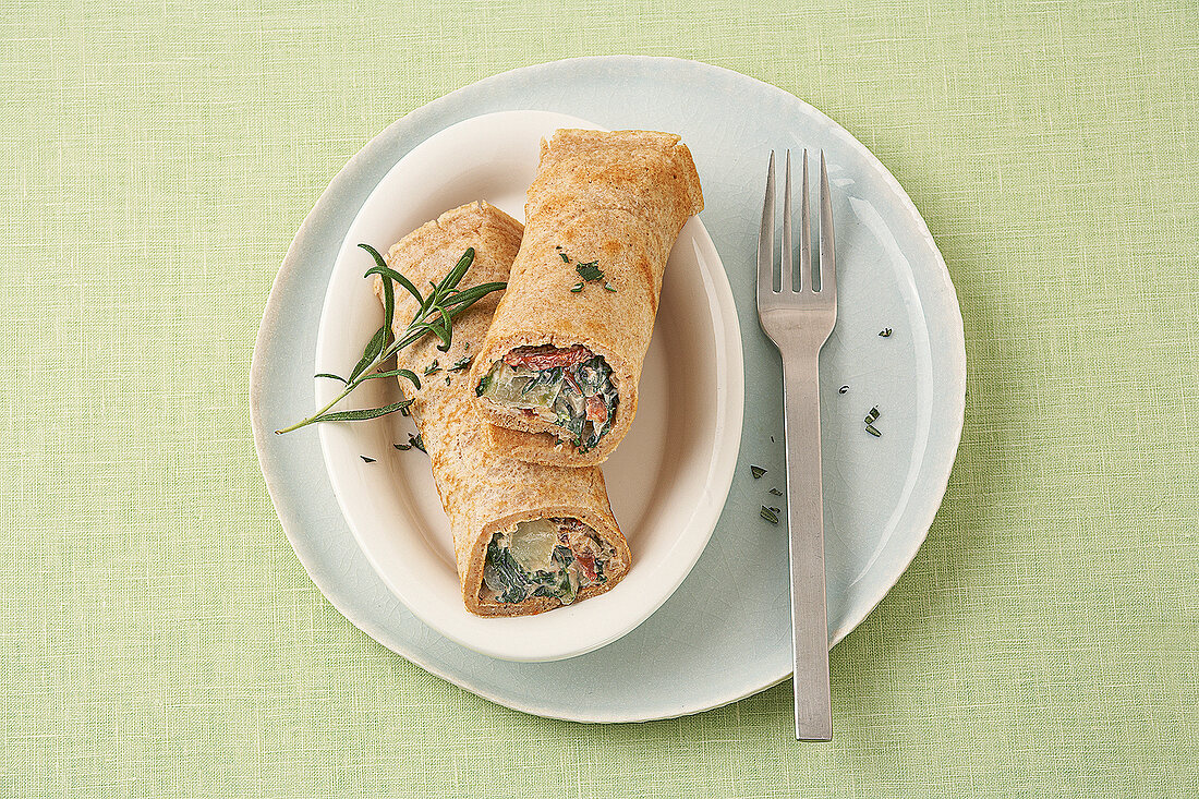 Cheese pancakes stuffed with mangold on plate