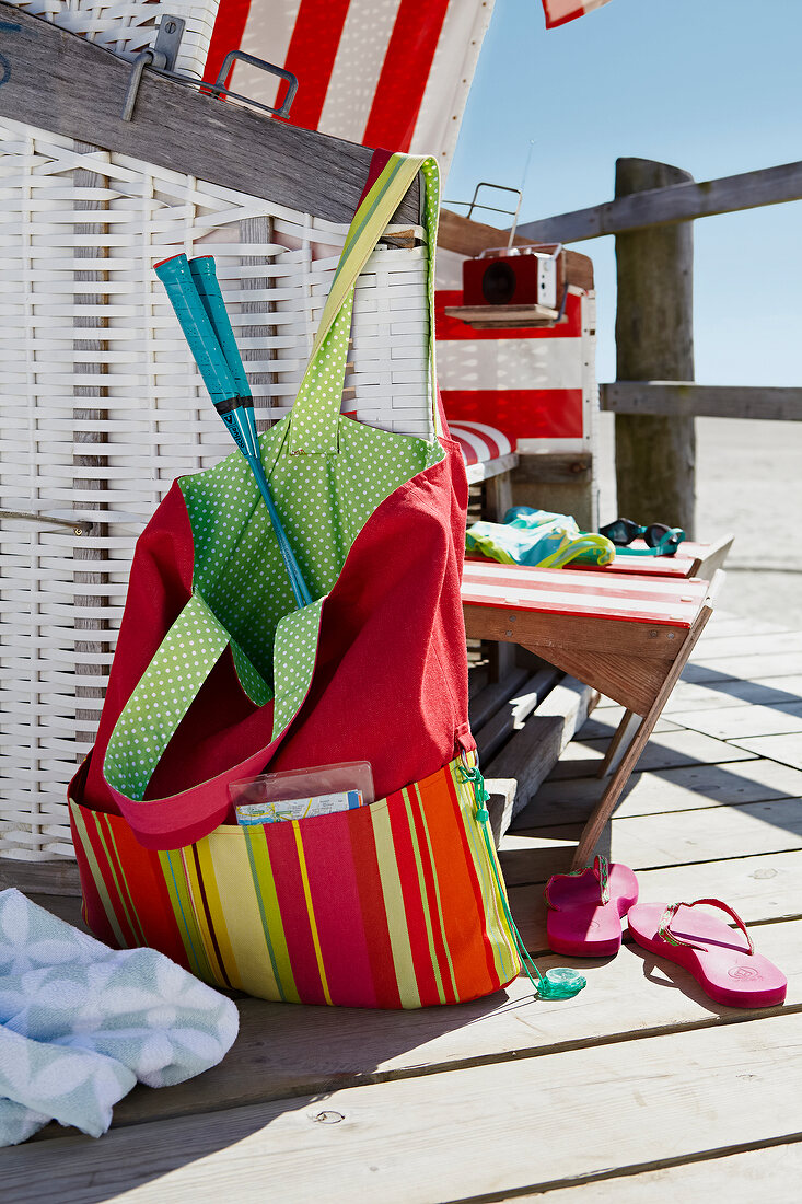 Colourful bag and chair at beach
