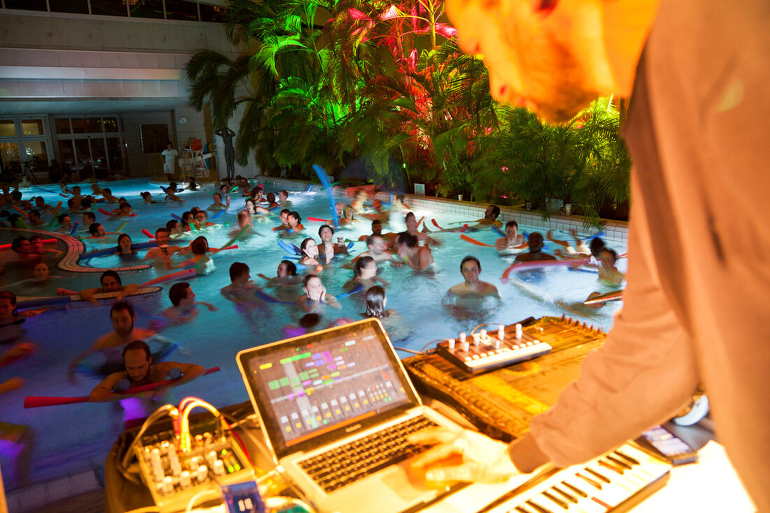 People in pool at Antigel festival with DJ Robert Lippok, Collonge-Bellerive, Switzerland