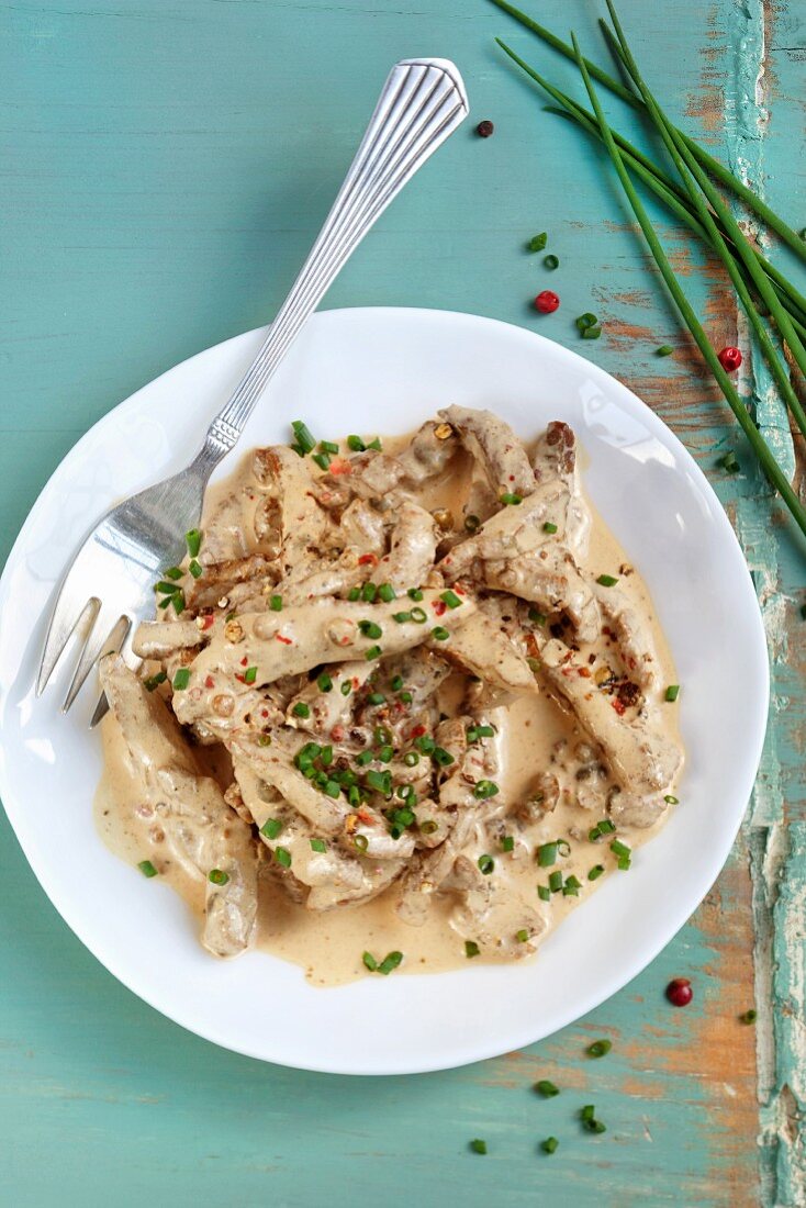 Strips of beef in a creamy three pepper sauce