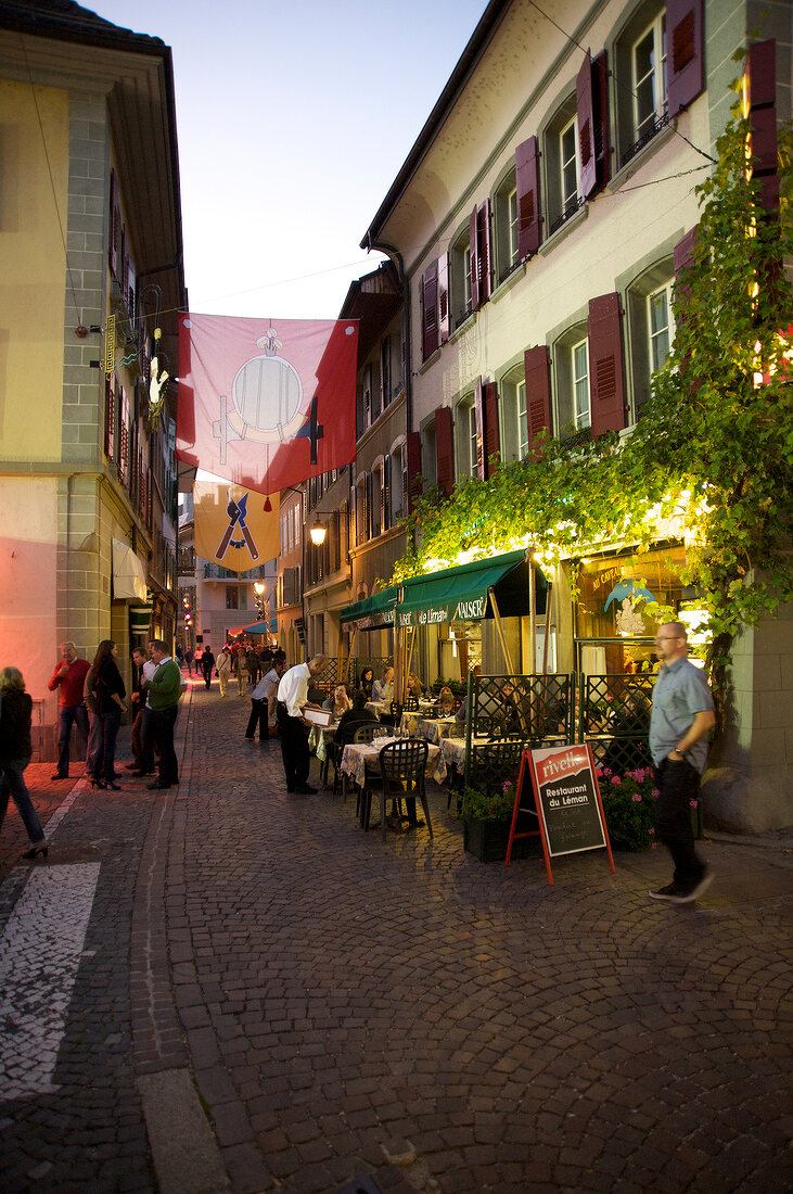 People on street near cafe Restaurant du Leman, Geneva, Switzerland