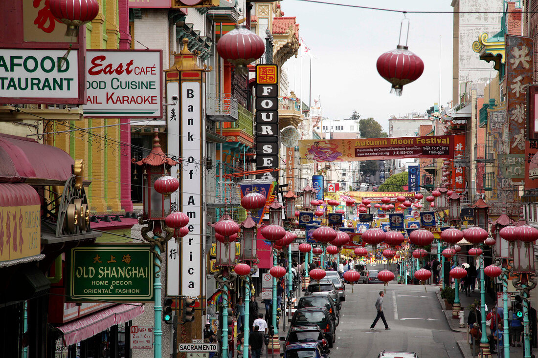 Busy street of Chinatown overlooking the Bay Bridge in San Francisco