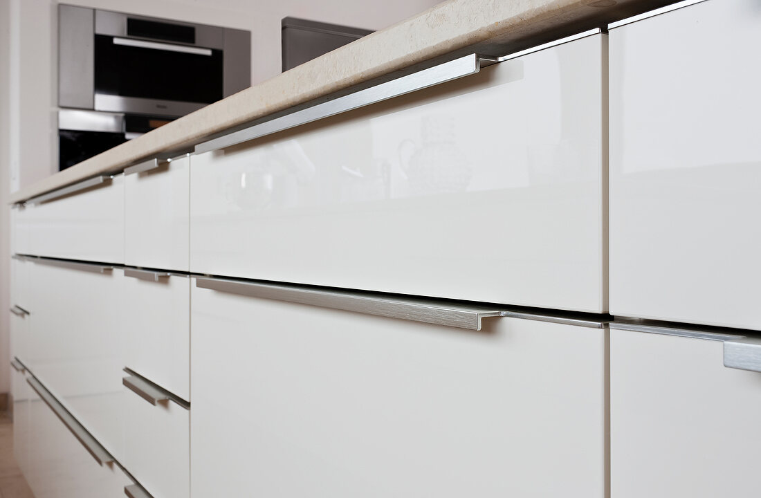 Close-up of kitchen with white cabinets