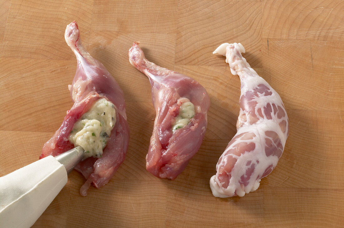 Stuffing quail legs with pork caul, step 2
