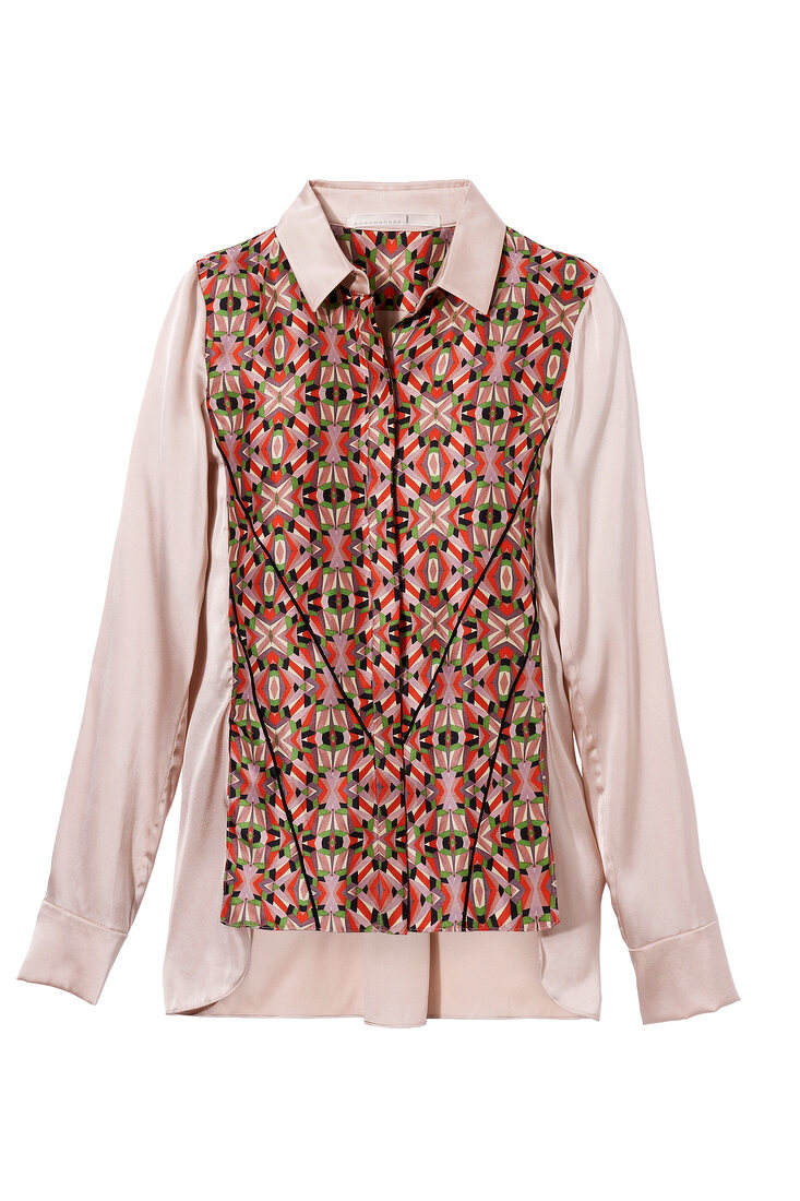 Close-up of patterned blouse on white background