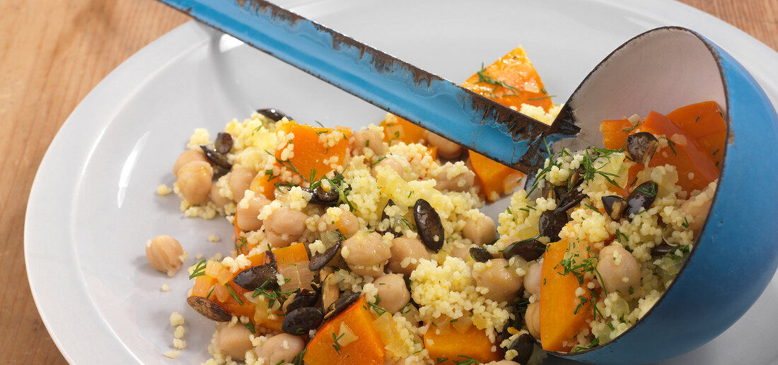 Couscous with pumpkin on plate