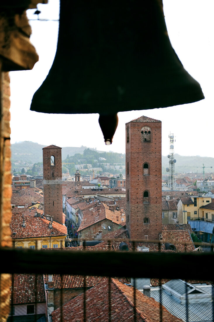 View of Old town through church bell, Alba in Italy