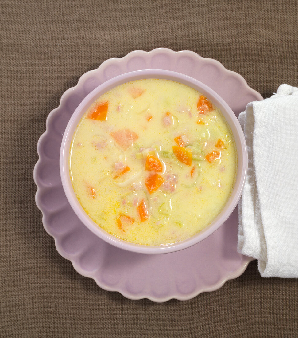 Roasted semolina soup in bowl, overhead view