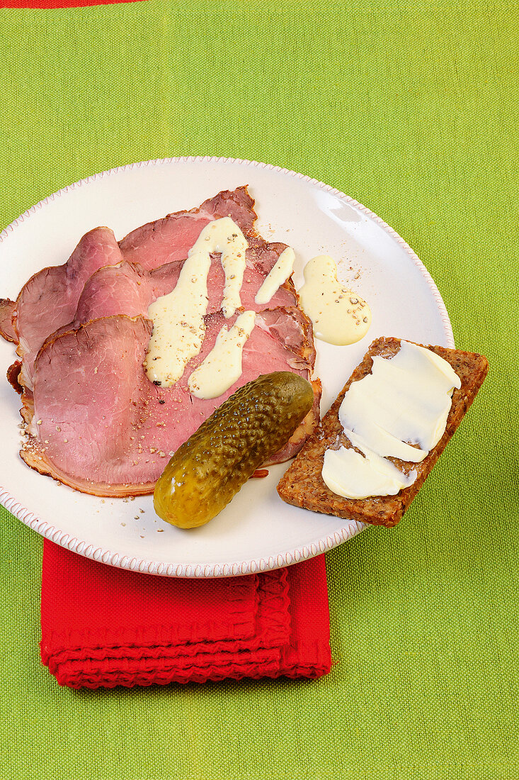 Roast beef with pickles on plate