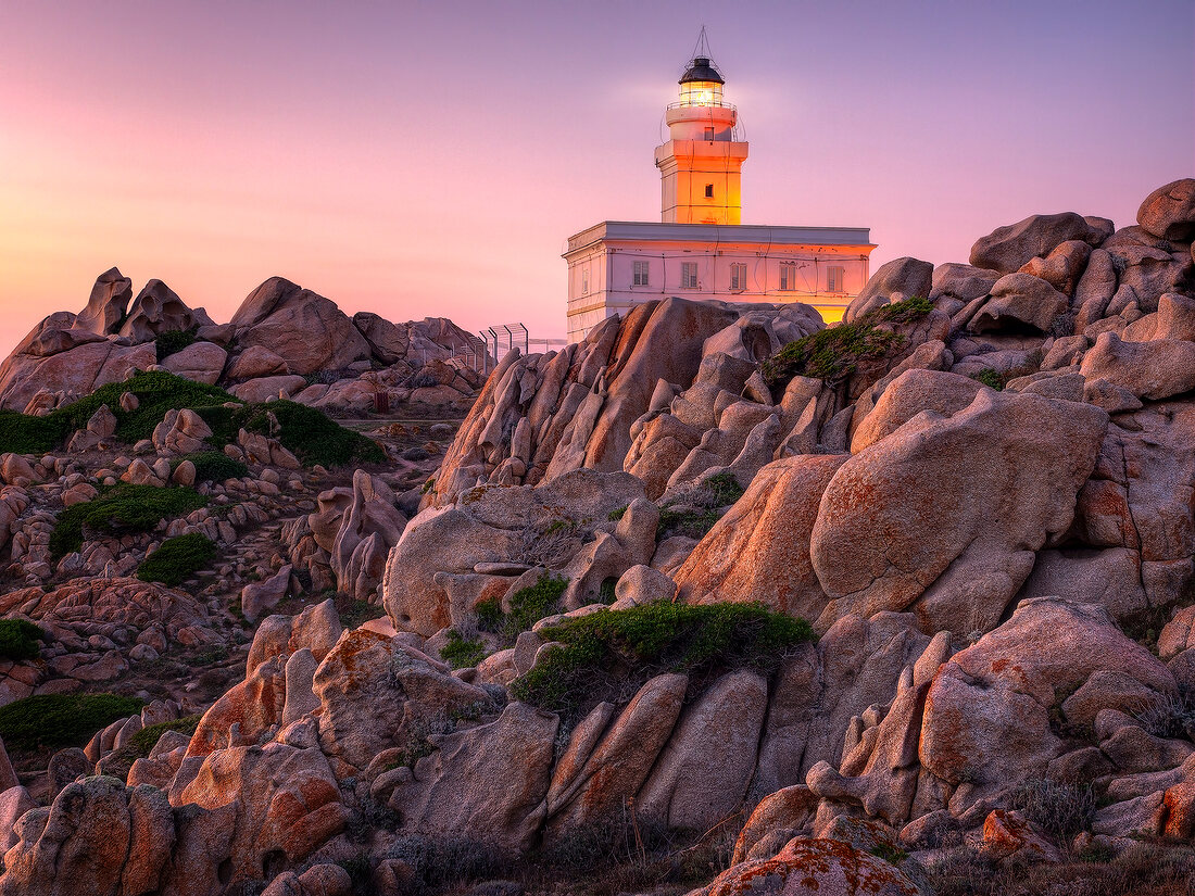 View of lighthouse at dusk in Capo Testa, Sardinia, Italy