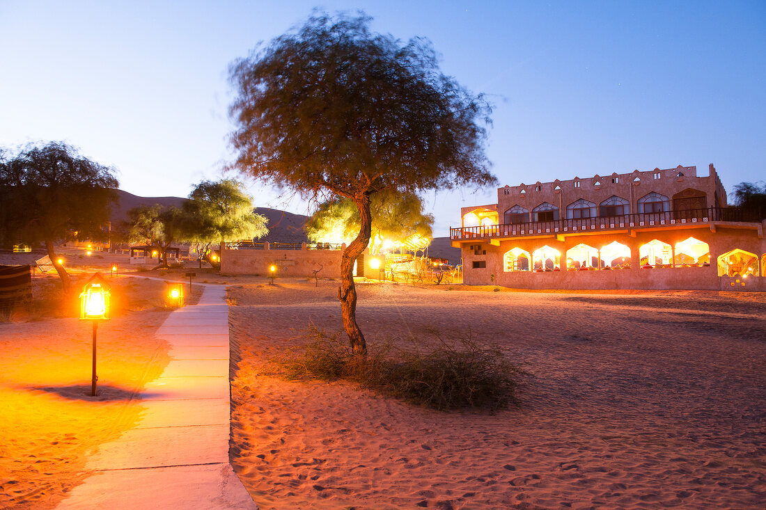 Illuminated hotel of 1000 Nights Camp in Wahiba Sands, Oman
