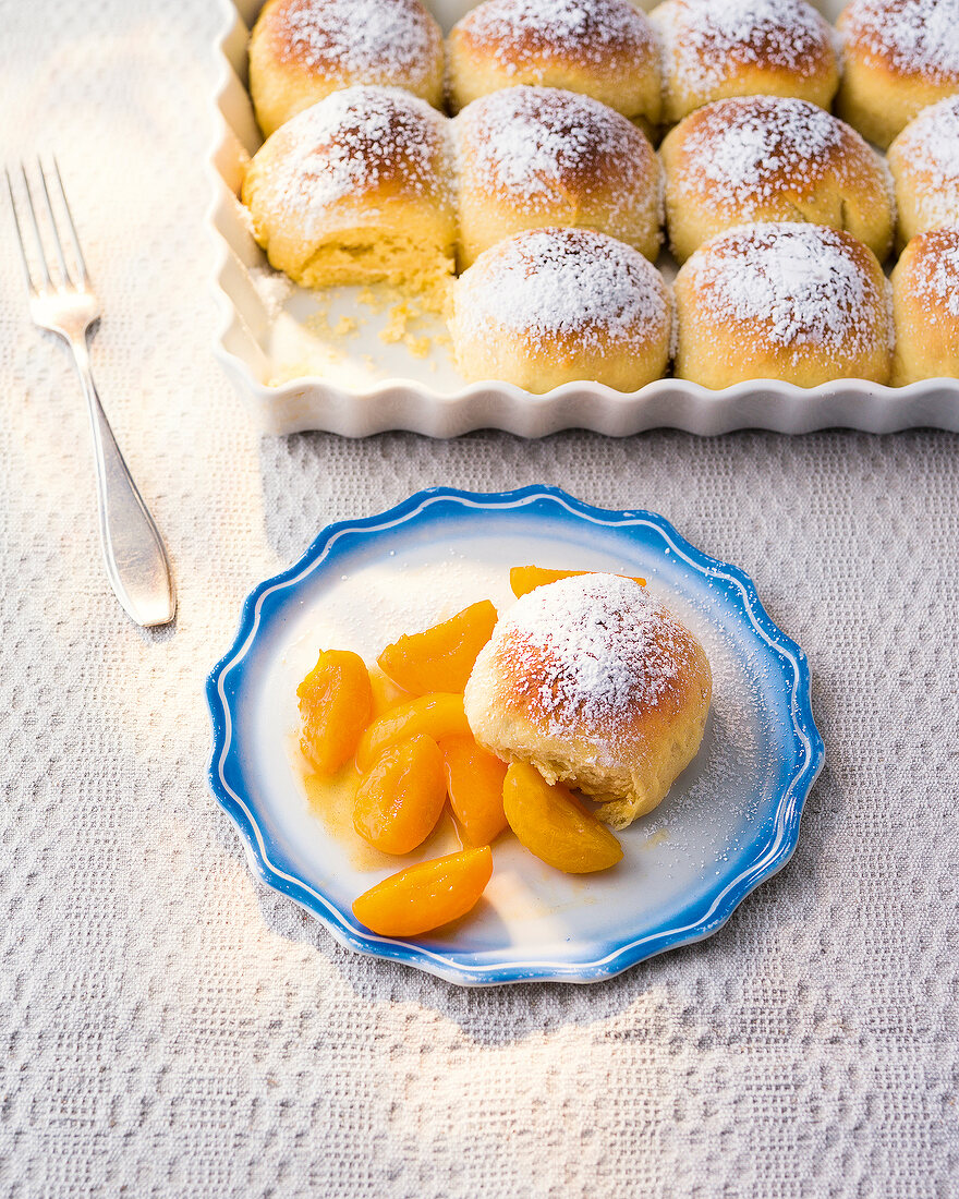 Marzipan dumplings with stewed apricots on plate