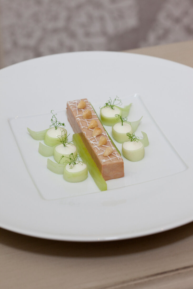 Perigord foie gras with cucumber, elderflower and yogurt on plate