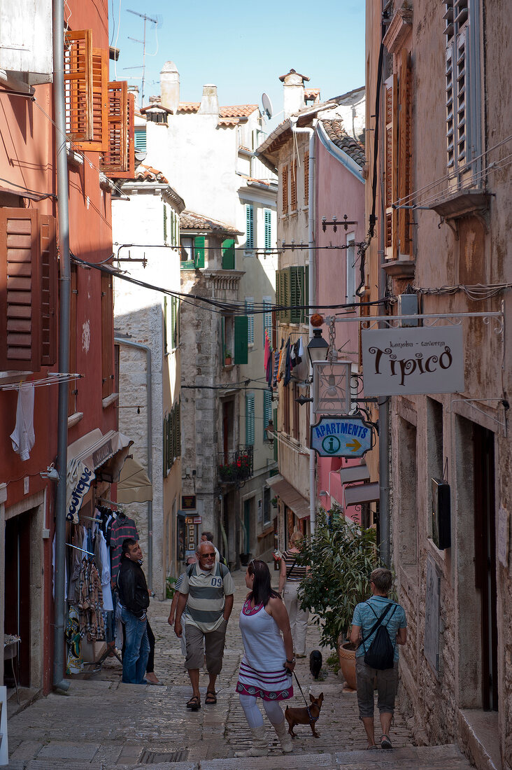 People walking in alley in old town Rovinj, Croatia