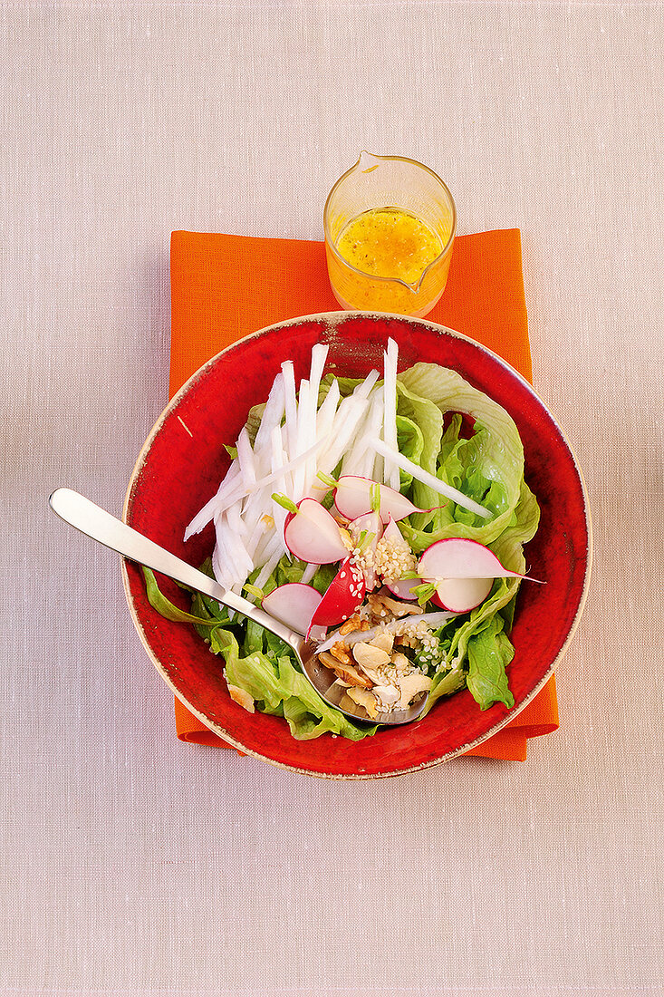 Salad with vegetable and nuts in bowl