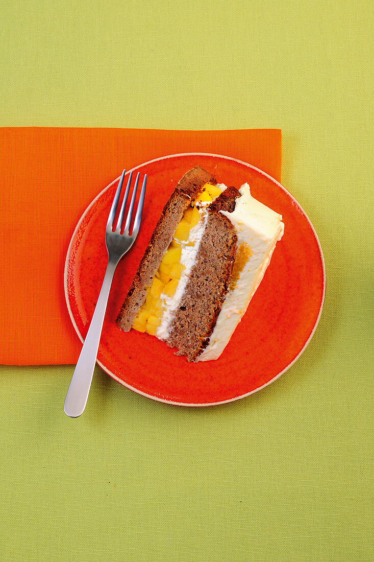 Slices of orange and mango cake on plate