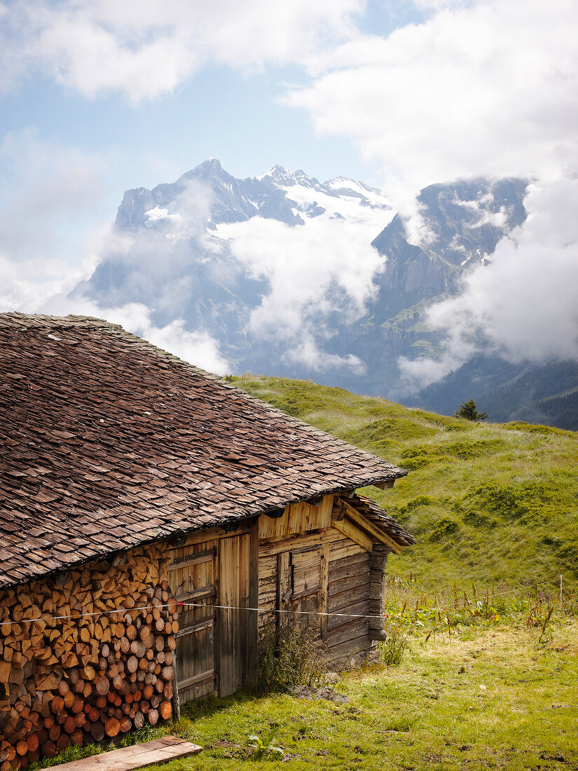 View of mountains and hut on landscape in Alps, Switzerland