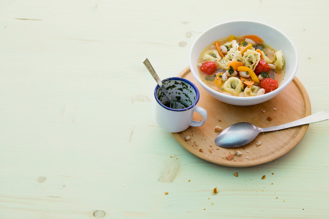 Tortellini and vegetable stew in bowl