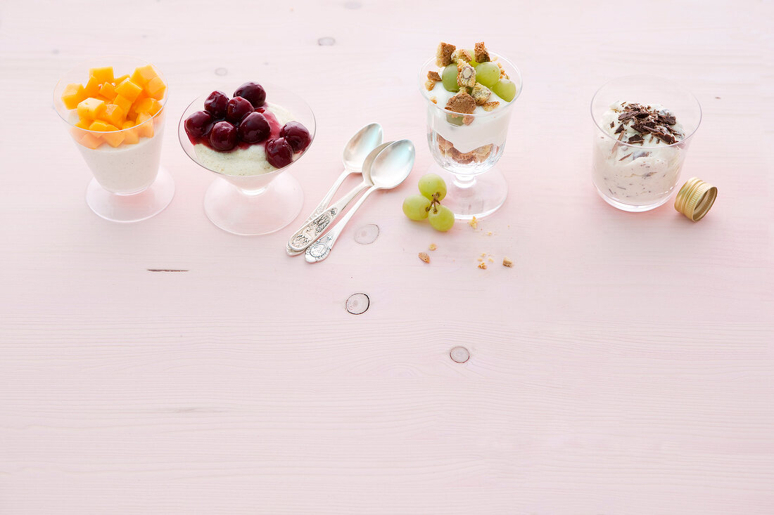 Four desserts in glasses