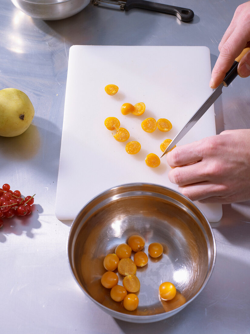 Physalis sliced in halves on white board