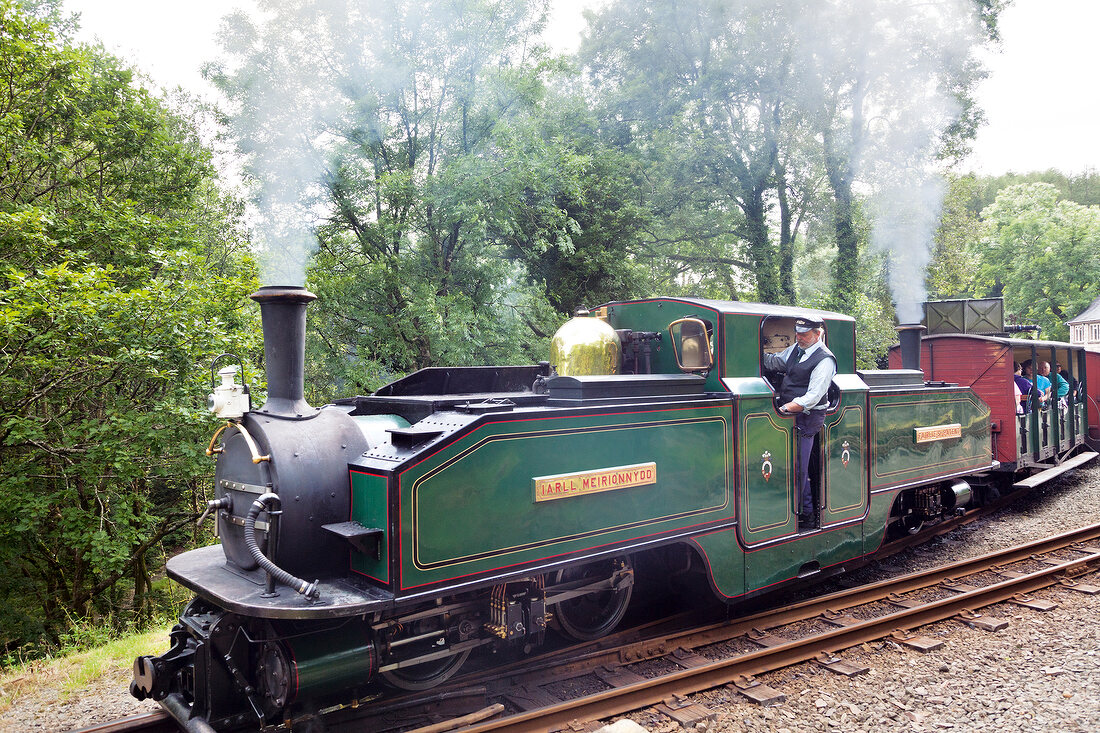 People in narrow gauge railway at Snowdonian National Park, Wales, UK