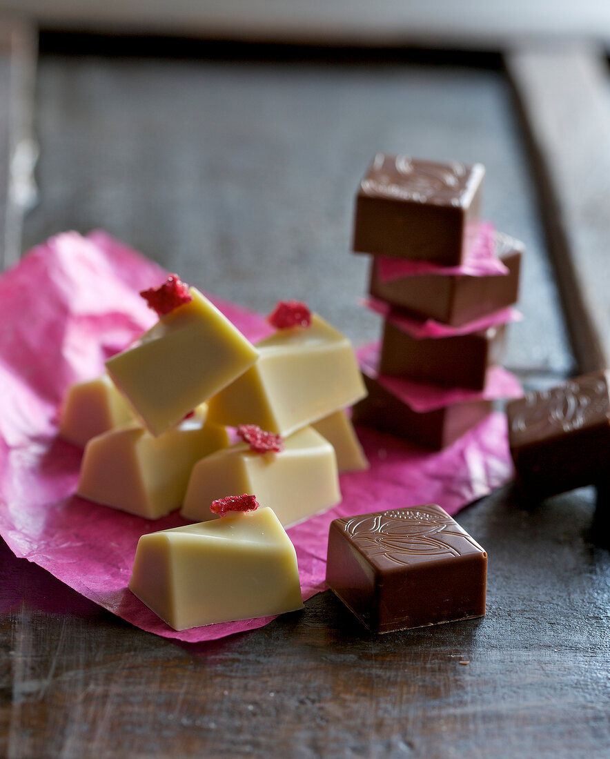 Close-up of raspberry and blueberry pralines chocolates