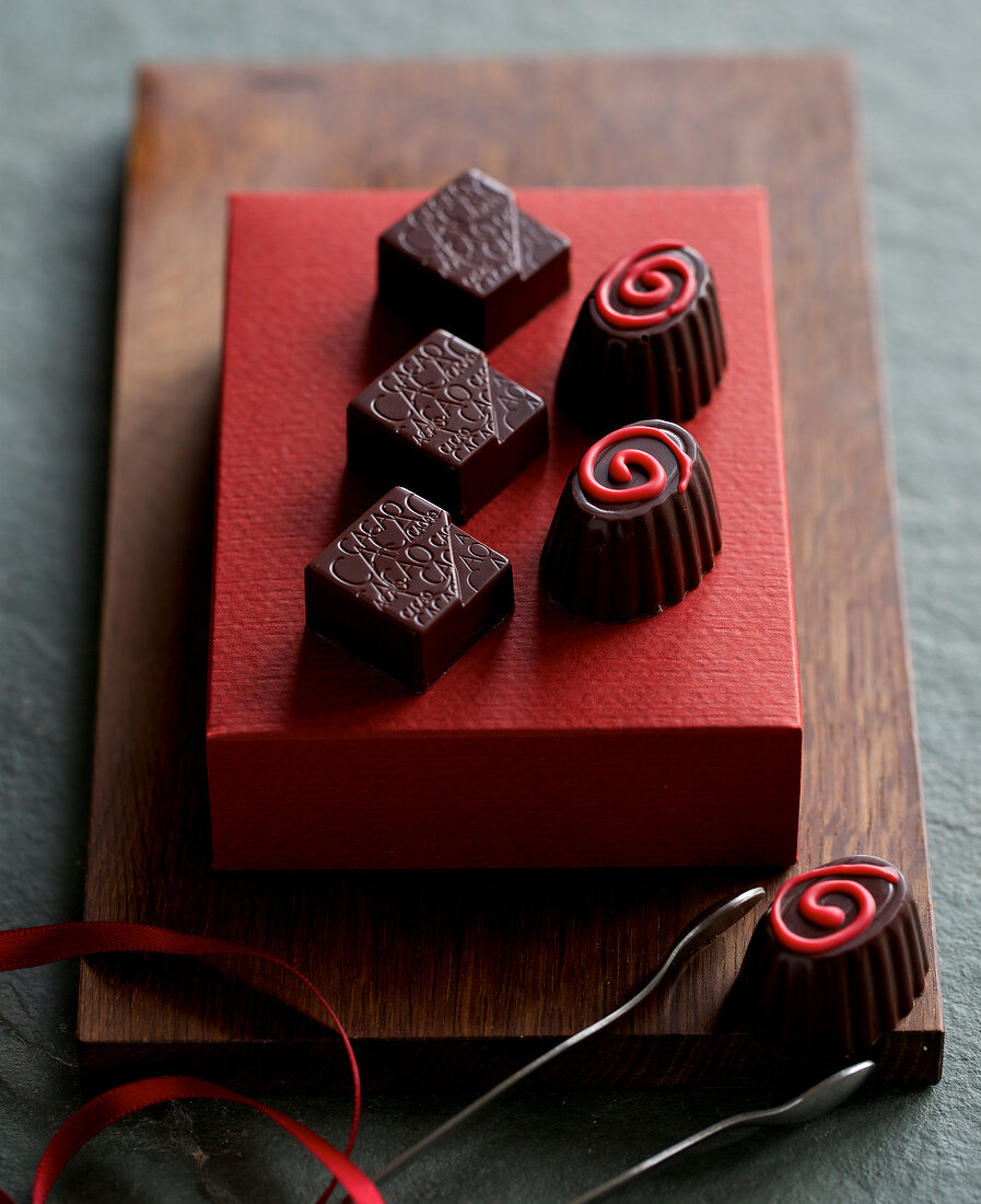 Kumquat and cranberry chocolates with chilli icing