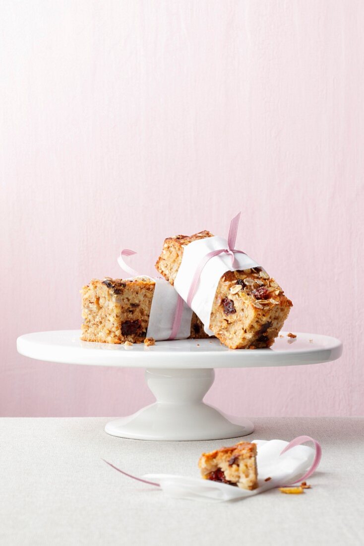 Pieces of fruit muesli cake on a cake stand