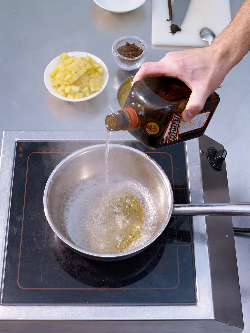Caramelize cane sugar and deglaze with orange liqueur in saucepan