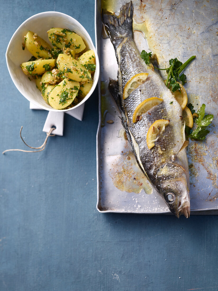 Sea bass with salsa verde potatoes, overhead view