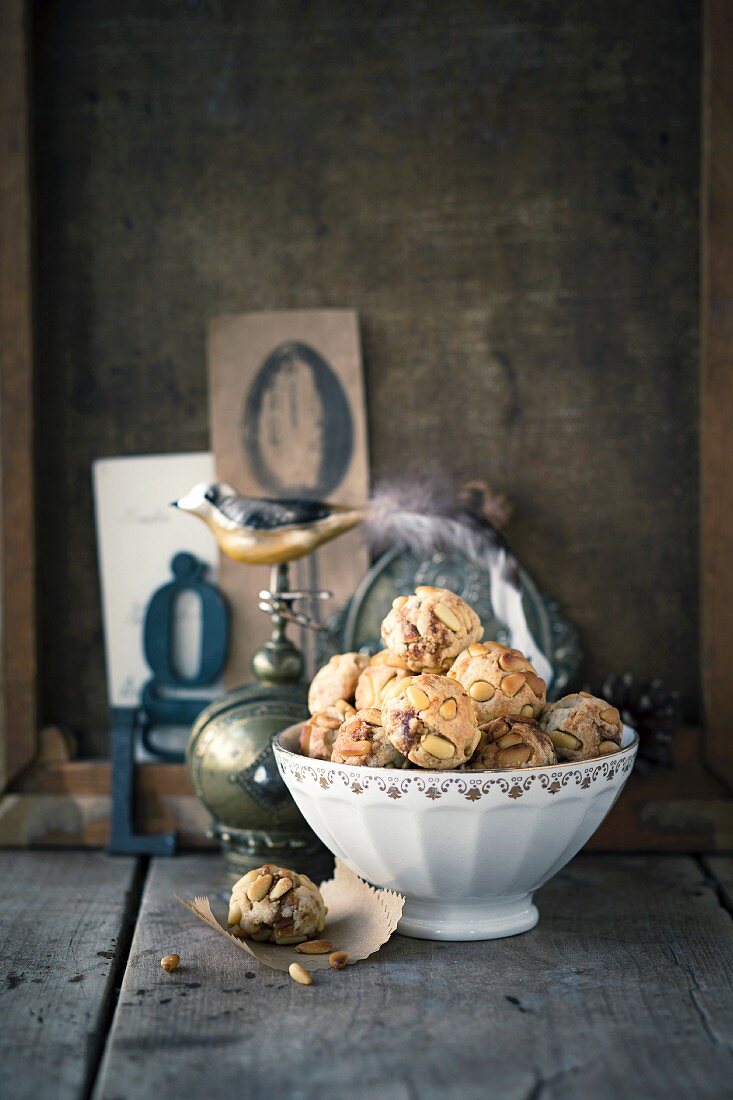 Fig and pine nut balls in a white porcelain bowl