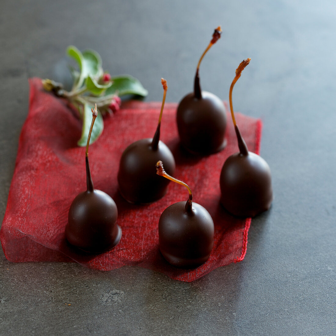 Cherry chocolate on red cloth