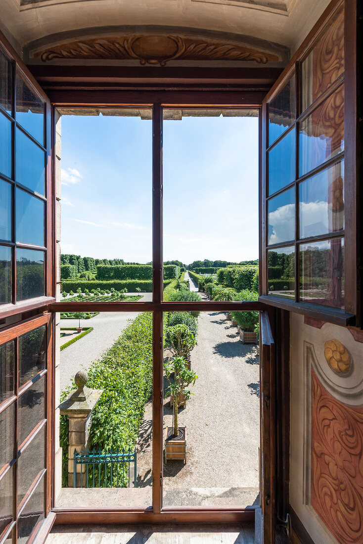 View of Royal gardens through window of Herrenhausen Palace, Hanover, Germany
