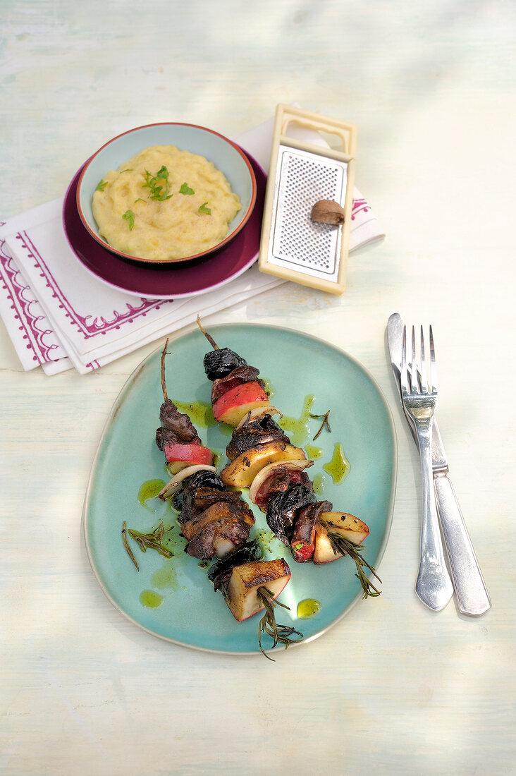 Rosemary skewers with chicken liver on plate