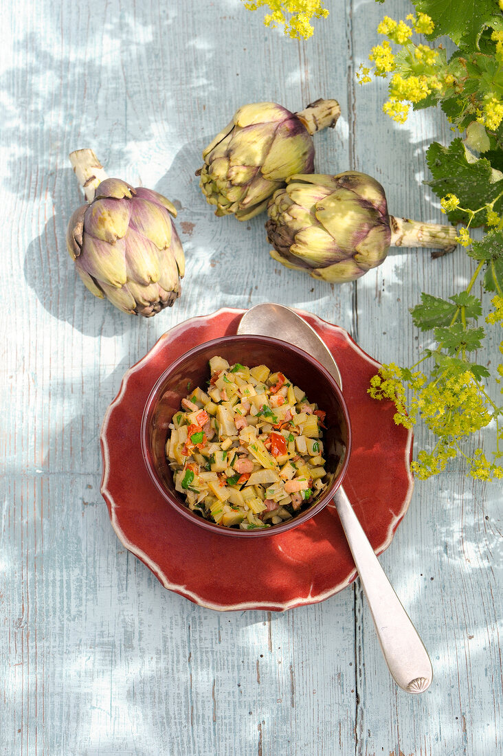 Three artichokes with artichoke bacon sauce