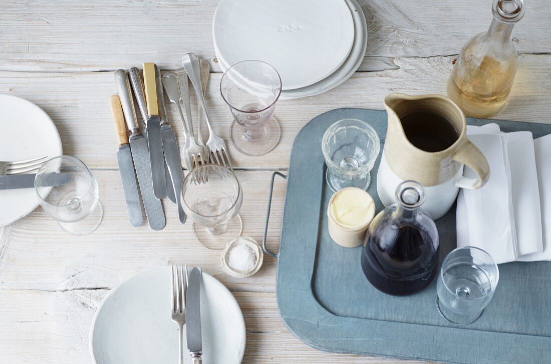 Crockery, cutlery and glasses on a wooden table