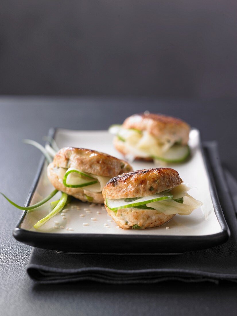 Mini chicken burgers with cucumber and wasabi