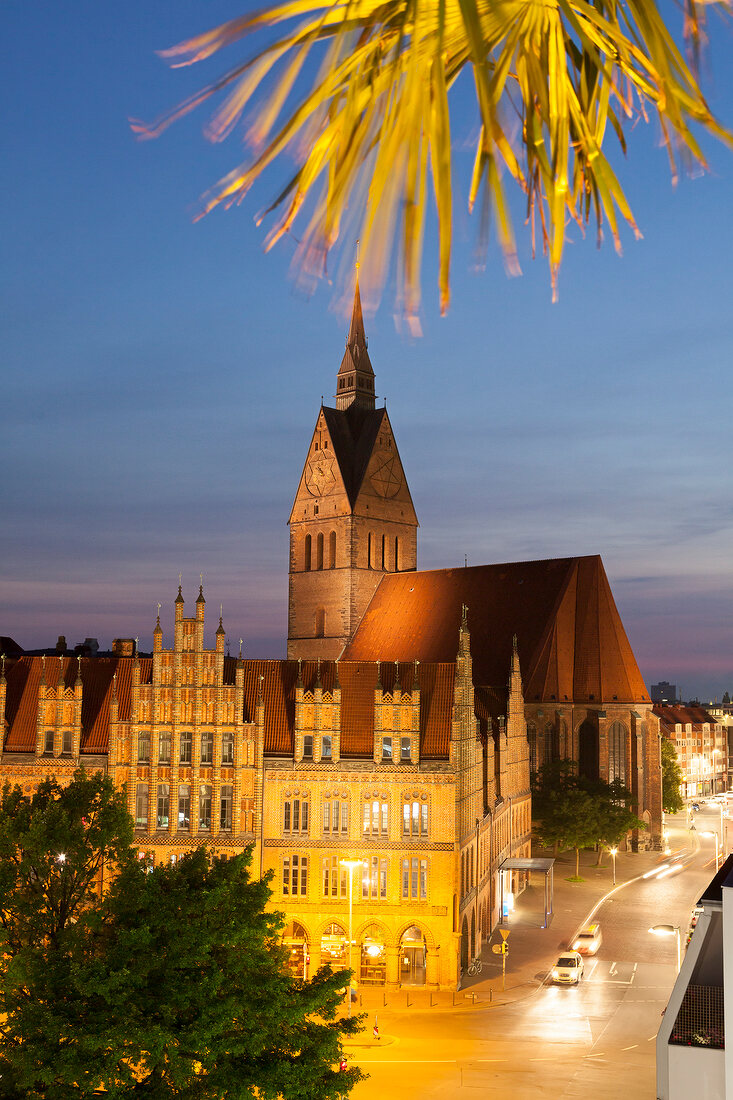 People sitting at Beach Club with Market Church Old Town Hall, Hannover, Germany