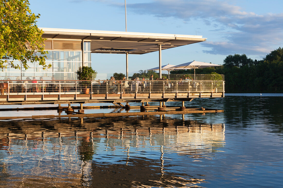 People sitting at terrace of Pier 51 Restaurant in Maschsee, Hannover, Germany