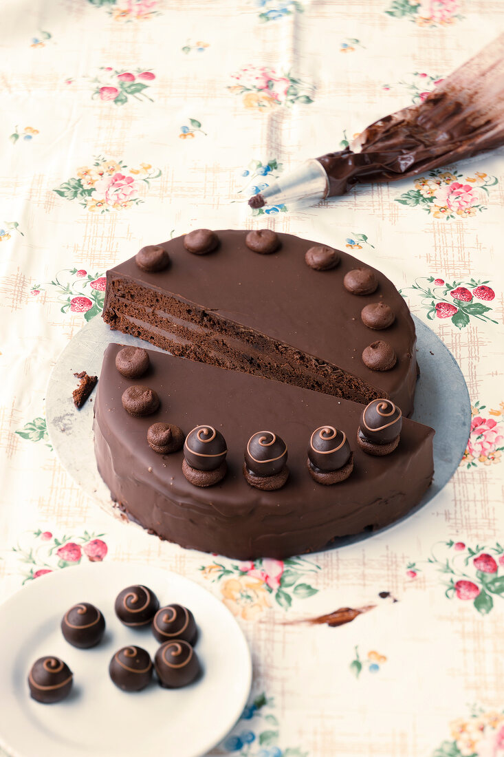 Chocolate truffle cake with Chocolate truffles on plate