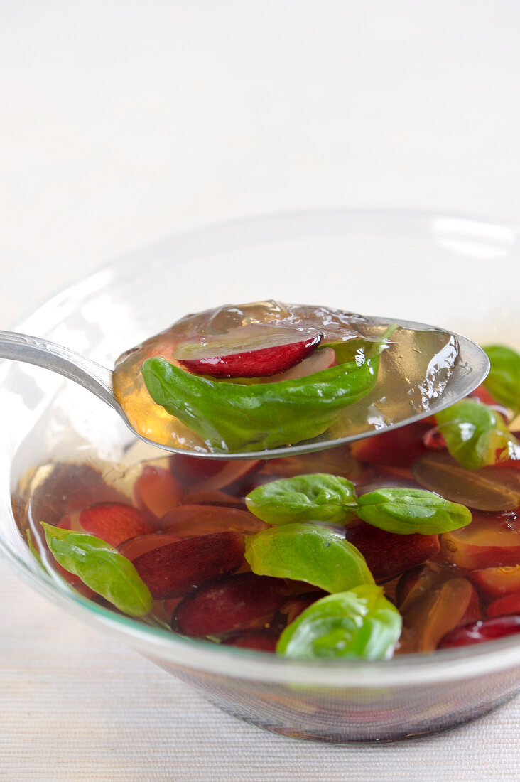Close-up of wine jelly with grapes on spoon