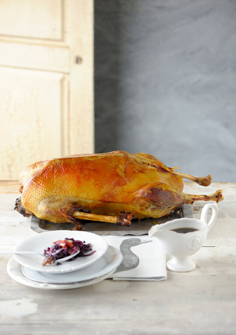 Goose stuffed with red cabbage on tray