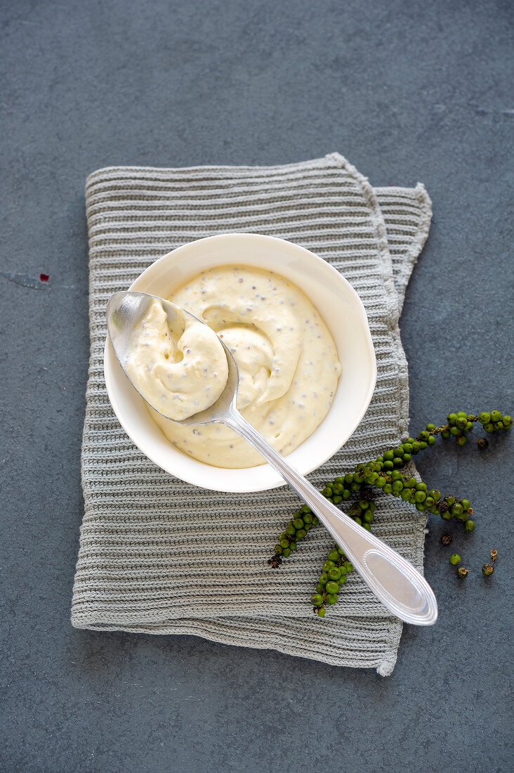 Mustard cream with pepper in bowl